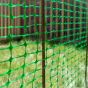 Green mesh barrier fencing installed around tree protection zone on construction site | CMT Group UK