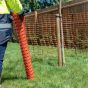 Orange mesh barrier fencing installed around active excavation hazard zone on construction site | CMT Group UK