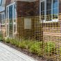 Yellow mesh barrier fencing installed around street works utility excavation zone | CMT Group UK