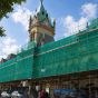 Green debris netting installed on scaffold face of historic building construction site | CMT Group UK