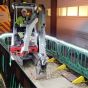 UtilityLite LED strip on green construction barriers alongside Network Rail mini excavator site operation | CMT Group UK