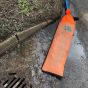 Green Rhino oil and sediment filter deployed at drain with 2 inch pump discharge hose active use | CMT Group UK
