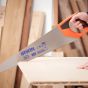 Carpenter using universal panel saw cutting structural timber on construction site | CMT Group UK