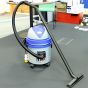 MAX 110V L-class wet and dry vacuum cleaner in use on construction site with hose and floor nozzle | CMT Group UK