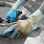 Natural latex gauntlets side view showing 300mm gauntlet length and cuff construction - application on site | CMT Group UK