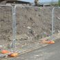 Securasite round top temporary site fence panel installed on construction site with rubber block feet | CMT Group UK