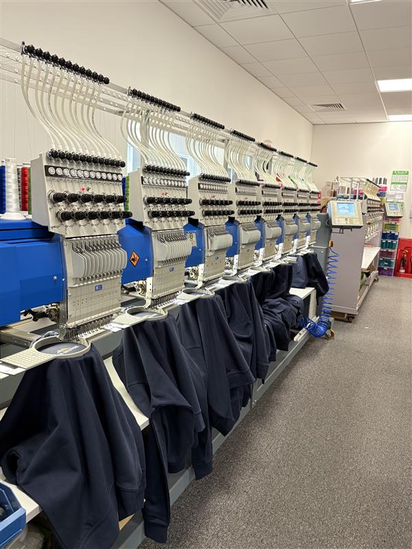 CMT BrandIT in-house embroidery machines producing branded workwear